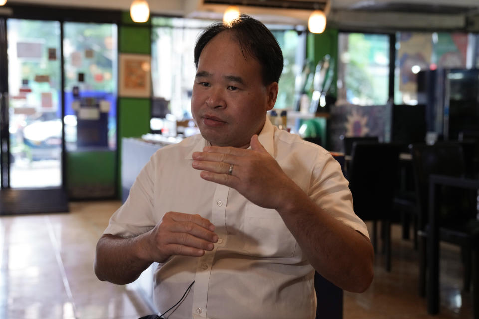 Shenzhen Holy Reformed Church Pastor Yongguang gestures during an interview with The Associated Press in Bangkok, Thailand, Monday, Sept. 5, 2022. Pastor Pan says his church members are seeking refuge in Thailand, saying they face state harassment and possible deportation. (AP Photo/Sakchai Lalit)