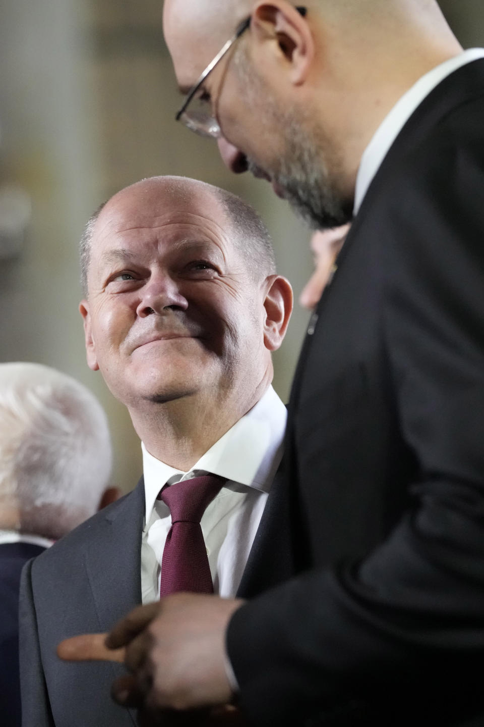 Germany's Chancellor Olaf Scholz, left, speaks with Ukraine's Prime Minister Denys Shmyhal at group photo during a meeting of the European Political Community at Prague Castle in Prague, Czech Republic, Thursday, Oct 6, 2022. Leaders from around 44 countries are gathering Thursday to launch a "European Political Community" aimed at boosting security and economic prosperity across the continent, with Russia the one major European power not invited. (AP Photo/Darko Bandic)