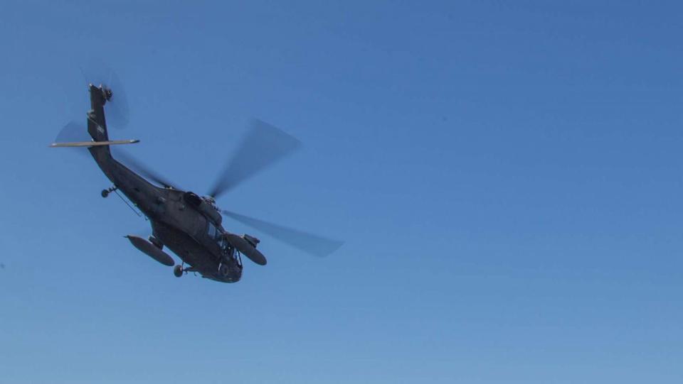 PHOTO: File image of a UH-60 Black Hawk, assigned to Joint Task Force-Bravo, departing the hospital ship USNS Comfort (T-AH 20), to pick up personnel from one of two medical sites, on Nov. 25, 2018. (U.S. Army photo by Spc. Joseph DeLuco, FILE)