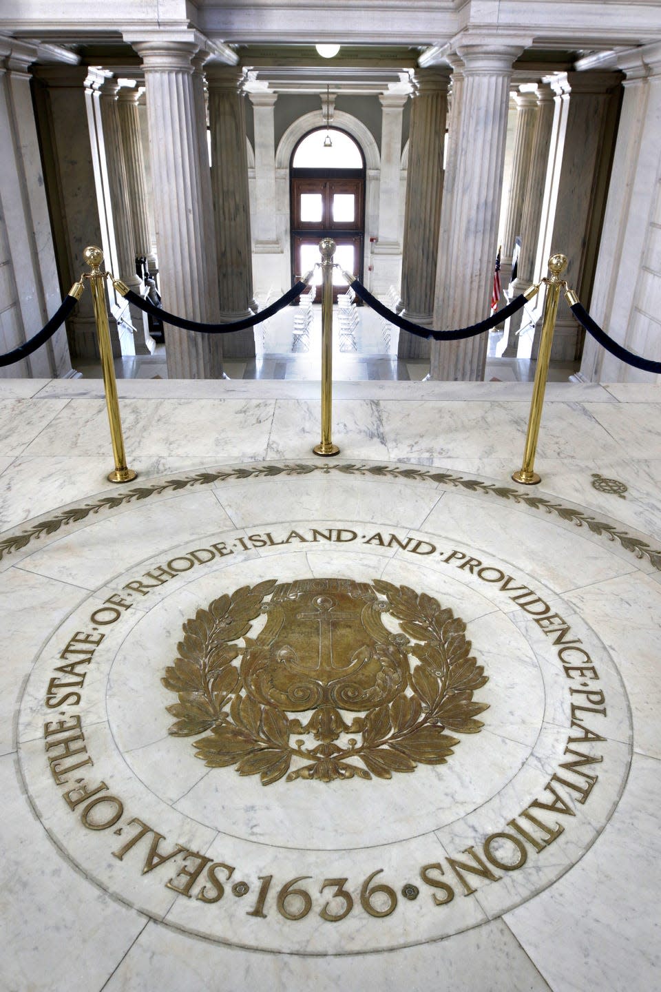 The state's former name embedded in the State House rotunda floor.