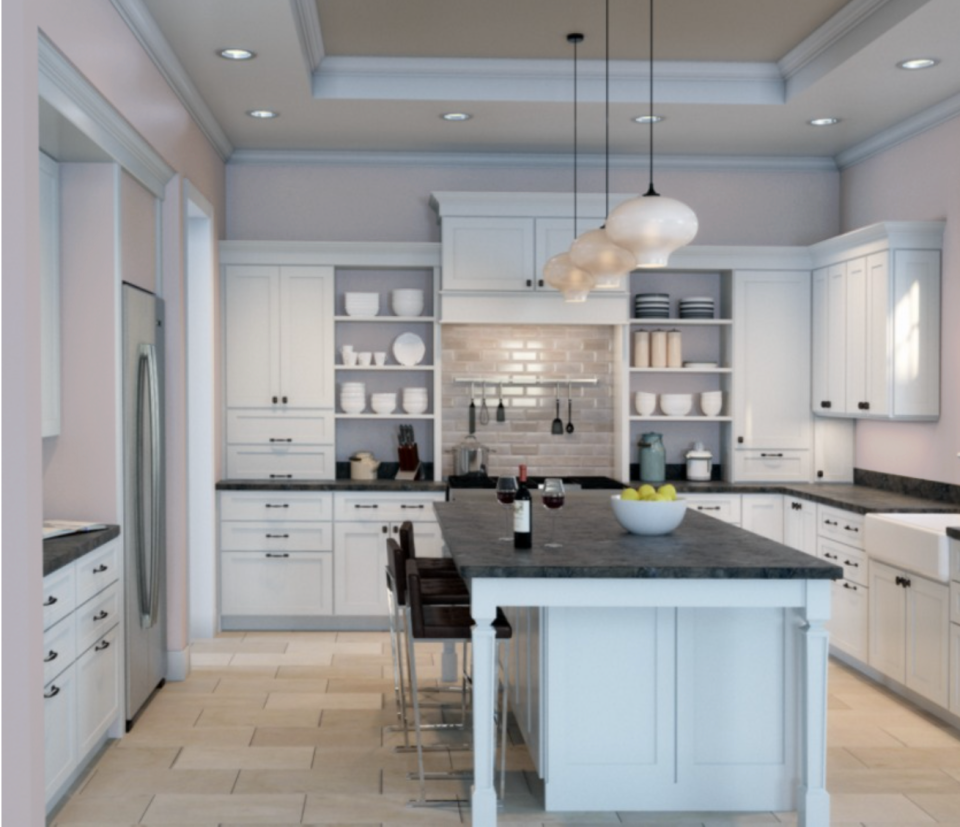 Kitchen with white cabinets and black countertops with walls painted in Wallflower by Sherwin-Williams.