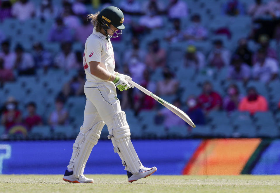 Australia's Will Pucovski walks from the field after he was dismissed during play on day three of the third cricket test between India and Australia at the Sydney Cricket Ground, Sydney, Australia, Saturday, Jan. 9, 2021. (AP Photo/Rick Rycroft)