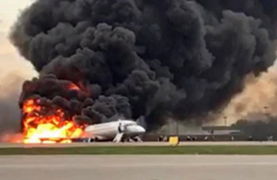 The Sukhoi Superjet 100 of Russian airline Aeroflot burning at Moscow's Sheremetyevo airport on Sunday. Source: AAP