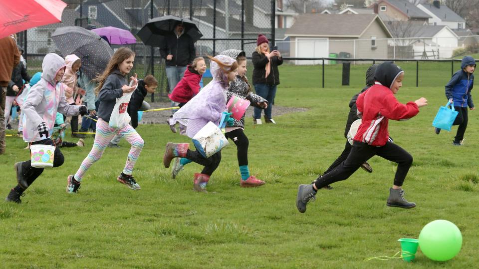 Children sprint to collect eggs Saturday during the North Canton Jaycees' annual Easter Egg Hunt in North Canton. More than 6,500 plastic eggs were available for the roughly 230 children.