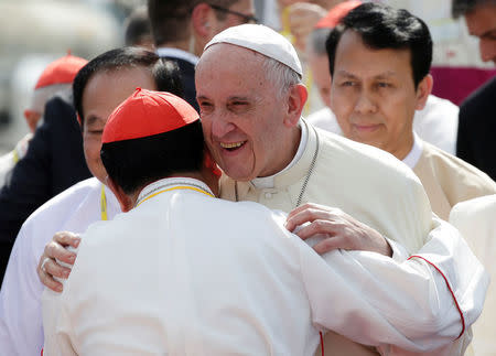 Pope Francis is embraced as he arrives at Yangon International Airport, Myanmar November 27, 2017. REUTERS/Max Rossi