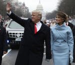 <p>President Donald Trump waves as he walks with first lady Melania Trump during the inauguration parade on Pennsylvania Avenue in Washington, Friday, Jan. 20, 2016. (Photo: Evan Vucci, Pool/AP) </p>