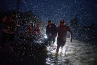 <p>Samaritans help push a boat with evacuees to high ground during a rain storm caused by Tropical Storm Harvey along Tidwell Road in east Houston, Texas, Aug. 28, 2017. (Photo: Adrees Latif/Reuters) </p>