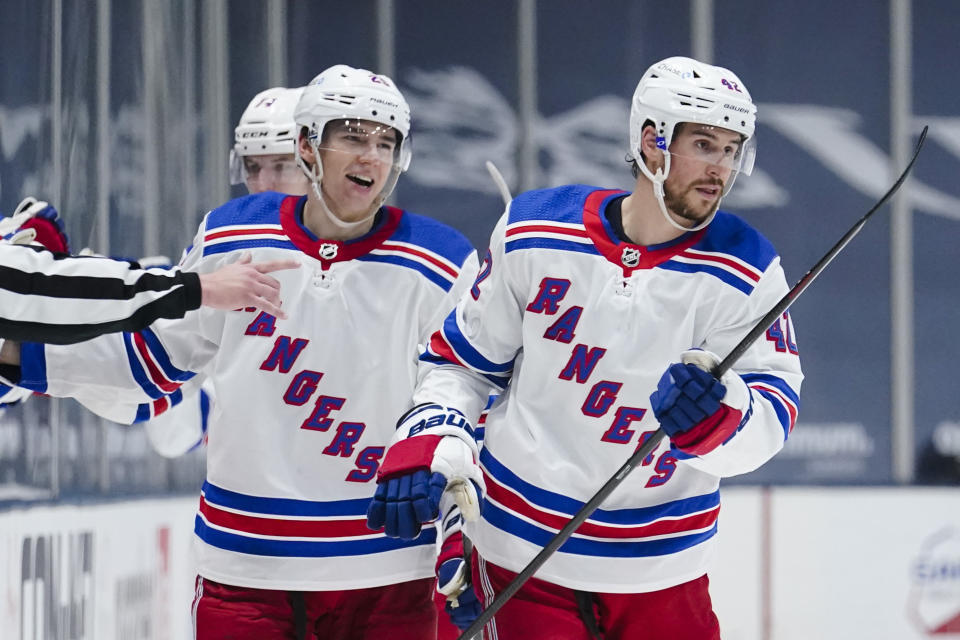 New York Rangers' Brendan Smith, right, and Libor Hajek, left, celebrates after Smith scored a goal during the second period of an NHL hockey game against the New York Islanders Sunday, April 11, 2021, in Uniondale, N.Y. (AP Photo/Frank Franklin II)