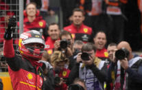 Ferrari driver Carlos Sainz of Spain celebrates after he clocked the fastest time during the qualifying session for the British Formula One Grand Prix at the Silverstone circuit, in Silverstone, England, Saturday, July 2, 2022. The British F1 Grand Prix is held on Sunday July 3, 2022. (AP Photo/Frank Augstein)