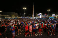 Italy supporters watch the Euro 2020 group A soccer match between Italy and Switzerland on a giant screen in Rome's central Piazza del Popolo, Wednesday, June 16, 2021. (Cecilia Fabiano/LaPresse via AP)