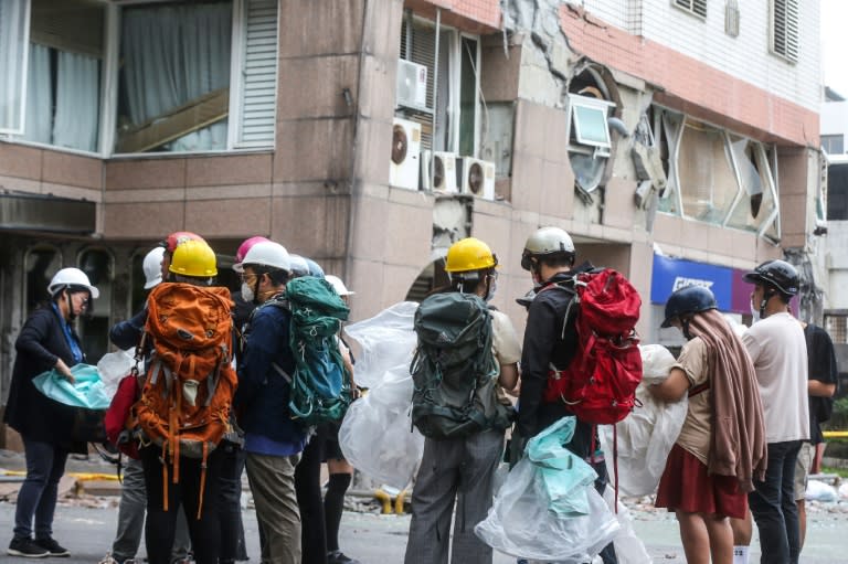 The residential Tongshuai building was damaged after the April 3 earthquake, and saw its first floor flattened in aftershocks more than two weeks later (I-Hwa CHENG)