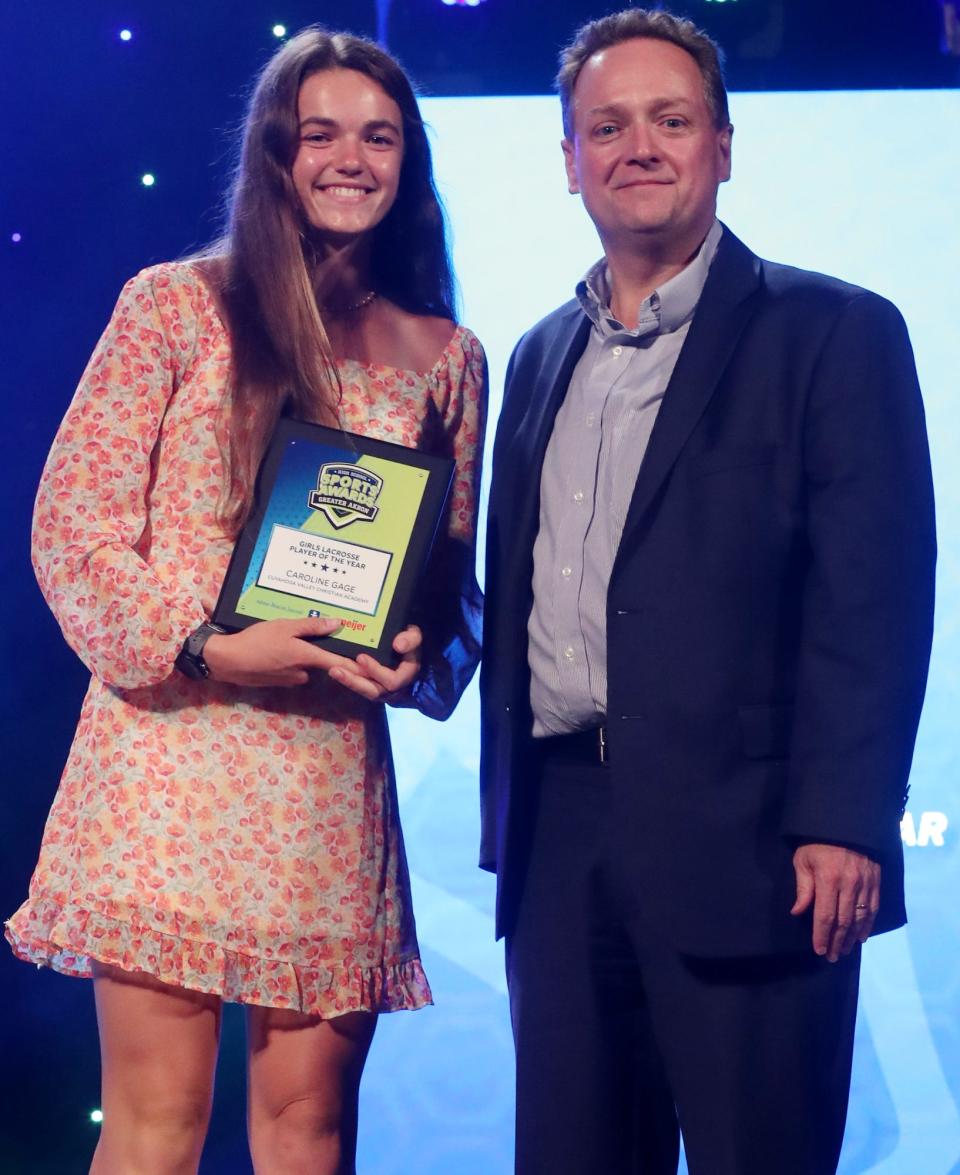 CVCA's Caroline Gage Greater Akron Girls Lacrosse Player of the Year with Michael Shearer Akron Beacon Journal editor at the High School Sports All-Star Awards at the Civic Theatre in Akron on Friday.