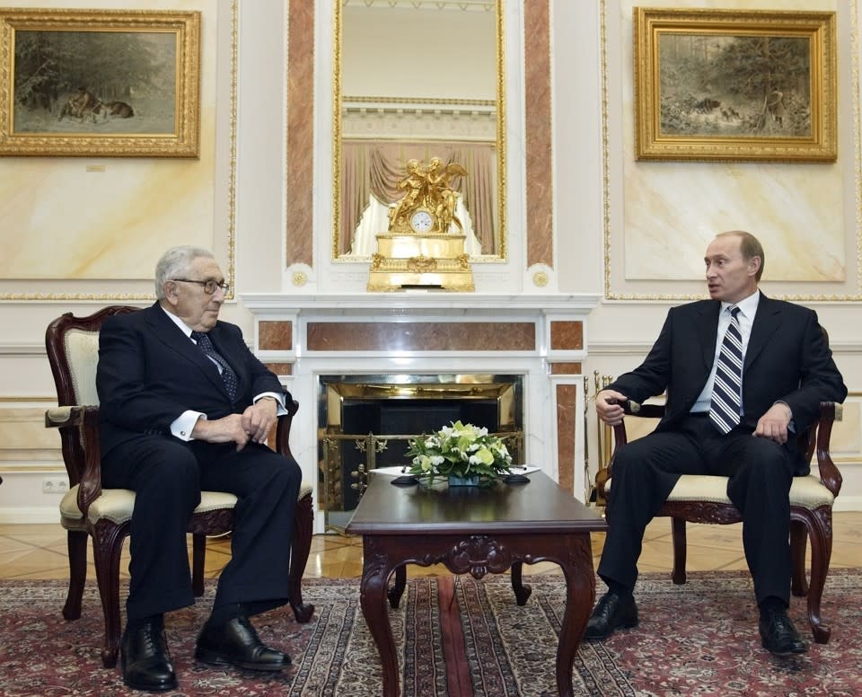 President Vladimir Putin speaks with former U.S. Secretary of State Henry Kissinger, left, at the Kremlin in 2007. (Alexander Zemlianichenko / AP)