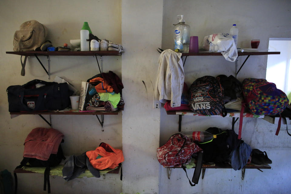 Migrants belongings sit on the shelves in what was the shelter kitchen but now houses women and children, at the Good Shepherd migrant shelter in Tapachula, Mexico, Tuesday, June 18, 2019. Most of the migrants at Good Shepherd are seeking refugee status in Mexico and awaiting documentation that could eventually allow them to find work and settle in the country. (AP Photo/Rebecca Blackwell)