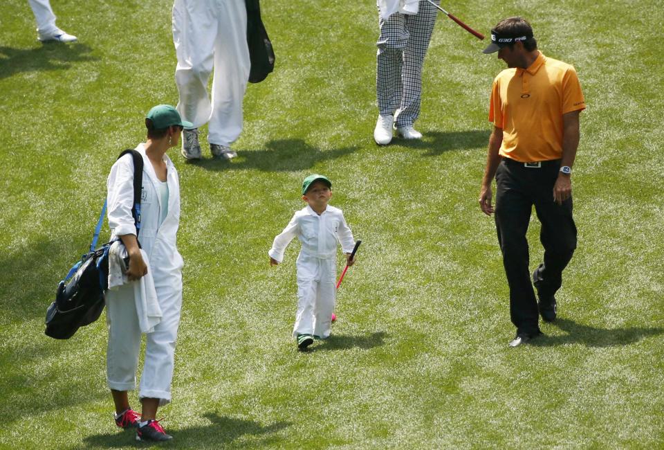 Bubba Watson of the U.S. participates in the par 3 event with his wife Angie (L) and son Caleb ahead of the 2015 Masters at Augusta National Golf Course in Augusta, Georgia April 8, 2015. REUTERS/Mark Blinch