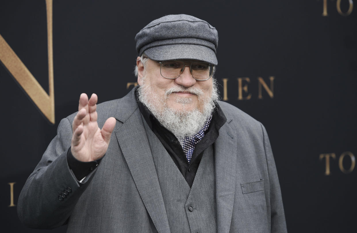 Author George R.R. Martin waves to photographers at the premiere of the film "Tolkien," at the Regency Village Theatre, Wednesday, May 8, 2019, in Los Angeles. The film explores the formative years of J.R.R. Tolkien, author of the classic fantasy novels "The Hobbit" and "The Lord of the Rings." (Photo by Chris Pizzello/Invision/AP)