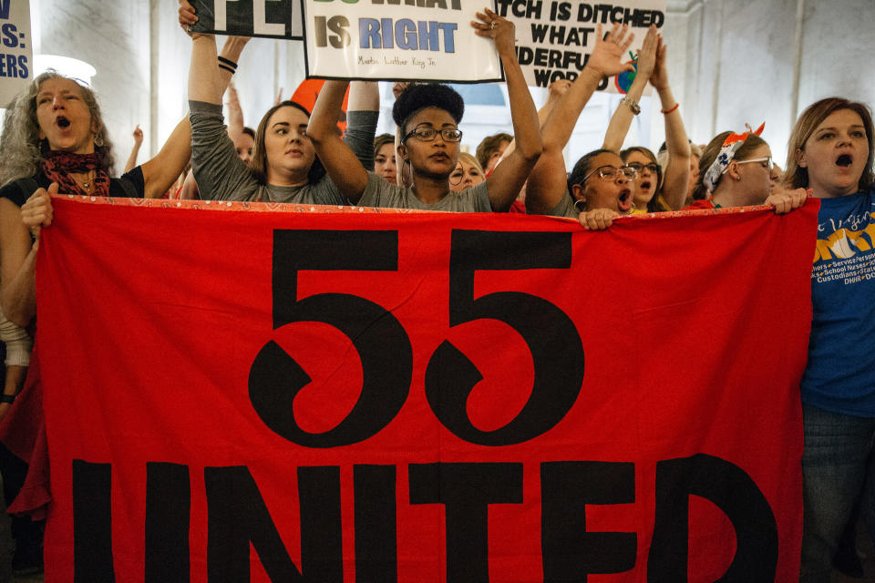 <p>Striking school workers hold a “55 United” sign while chanting inside the West Virginia Capitol in Charleston, W.Va., on Friday, March 2, 2018. (Photo: Scott Heins/Bloomberg via Getty Images) </p>