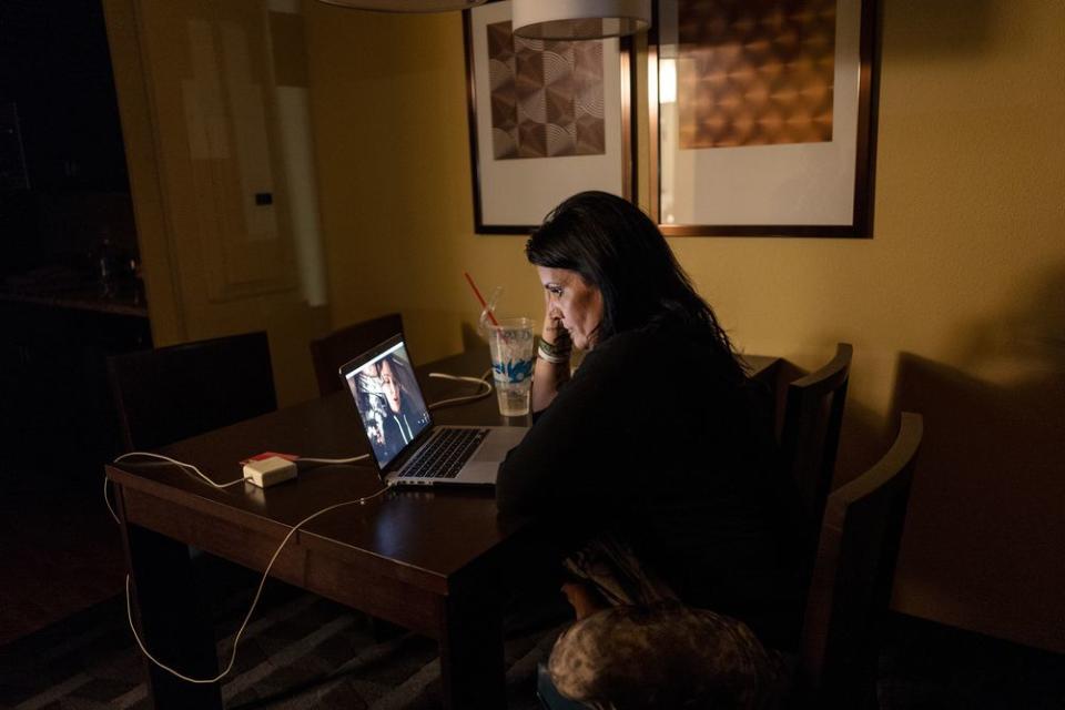 From her hotel room in North Dakota, Lazenko speaks with Adale, a human trafficking survivor in Utah, over Skype. Lazenko spends hours every day remotely helping women all over the US. | Lynsey Addario for TIME