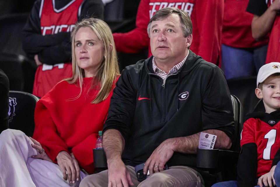 Feb. 17, 2024; Athens, Georgia, USA; Georgia Bulldogs head football coach Kirby Smart and his wife, Mary Beth Smart, watch the basketball game between Georgia and the Florida Gators at Stegeman Coliseum. Dale Zanine-USA TODAY Sports