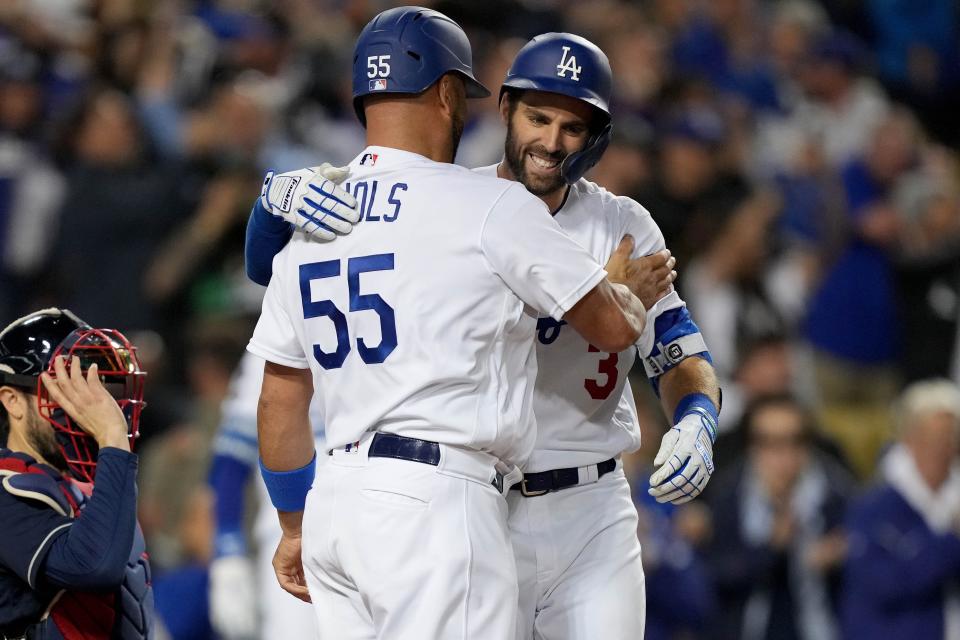 Dodgers' Albert Pujols celebrates with Chris Taylor after his second home run of the game.