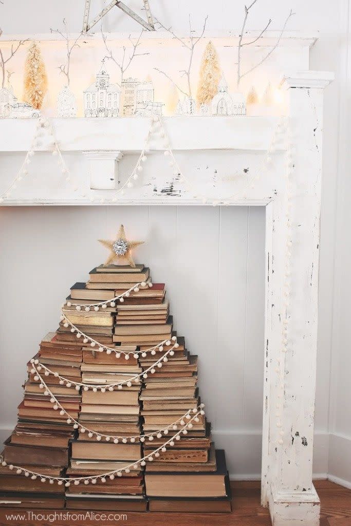 <p>Declare your love for reading with a book stack Christmas tree. Weathered old books are stacked in a tree shape and dressed up with a pom-pom garland and star, creating a look that's pure vintage Christmas. </p><p><strong>Get the tutorial at <a href="https://alicewingerden.com/2014/12/vintage-stacked-book-christmas-tree/" rel="nofollow noopener" target="_blank" data-ylk="slk:Alice Wingerden;elm:context_link;itc:0;sec:content-canvas" class="link ">Alice Wingerden</a>.</strong></p><p><a class="link " href="https://www.amazon.com/Snowball-Handmade-Felt-Sheep-Farm/dp/B078FM1FX7/ref=sr_1_3?tag=syn-yahoo-20&ascsubtag=%5Bartid%7C10050.g.28872053%5Bsrc%7Cyahoo-us" rel="nofollow noopener" target="_blank" data-ylk="slk:SHOP WHITE POM-POM GARLAND;elm:context_link;itc:0;sec:content-canvas">SHOP WHITE POM-POM GARLAND</a></p>