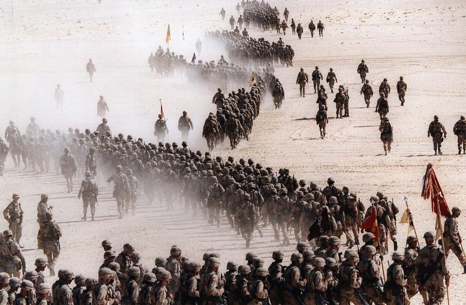 In this Nov. 4, 1990 file photo, responding to Iraq's invasion of Kuwait, troops of the U.S. 1st Cavalry Division deploy across the Saudi desert on  during preparations prior to the Gulf War. Twenty five years after the first U.S. Marines swept across the border into Kuwait in the 1991 Gulf War, American forces find themselves battling the extremist Islamic State group, born out of al-Qaida, in the splintered territories of Iraq and Syria. The Arab allies that joined the 1991 coalition are fighting their own conflicts both at home and abroad, as Iran vies for greater regional power following a nuclear deal with world powers.