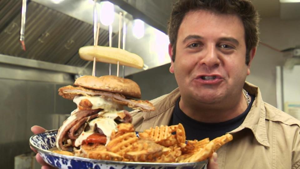 The Adam Emmenecker sandwich next to Adam Richman