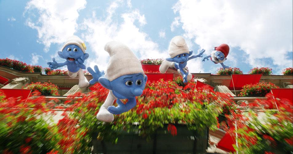 This publicity image released by Sony Pictures Animation shows from left, Vanity, voiced by John Oliver, Grouchy, voiced by George Lopez,Clumsy, voiced by Anton Yelchin, and Papa Smurf, voiced by Jonathan Winters in a scene from the film "Smurfs 2." (AP Photo/Sony Pictures Animation)