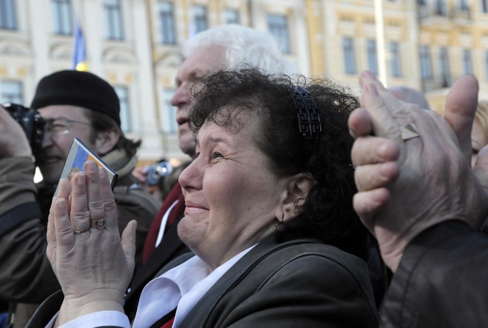 People reacts during former Ukrainian Prime Minister Yulia Tymoshenko, speech at the Batkivshchina (Fatherland) party congress in Kiev, Ukraine, Saturday, March 29, 2014. Tymoshenko, declared this week that she will "be the candidate of Ukrainian unity." The May 25 election is taking place against the backdrop of the annexation of Crimea, Ukraine's dire economic straits and rumblings of discontent in the country's mainly Russian-speaking eastern provinces. (AP Photo/Efrem Lukatsky)