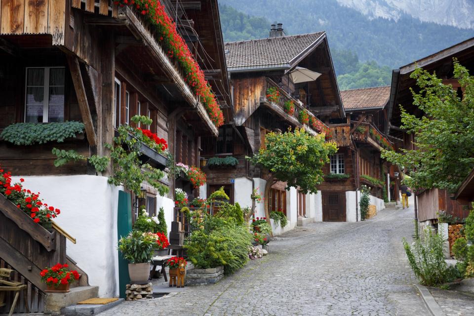 The most famous street in the picturesque village of Breinz, Switzerland, is the Brunngasse. The street’s 18th-century chalets showcase the wood carvings the village is known for, and window boxes are filled with colorful geraniums.