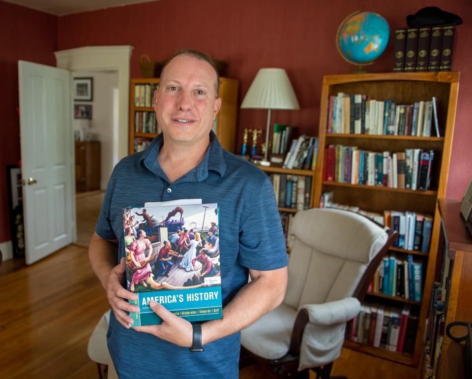 Franklin resident Phillip Balkus, a history teacher at Walpole High School, pictured at his home, July 8, 2022. He was awarded a James Madison Memorial Fellowship.