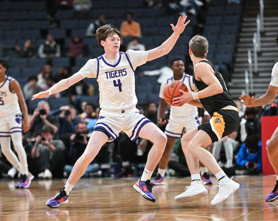 Pickerington Central's Gavin Headings defends Centerville's Gabe Cupps during the Play-by-Play Classic on Dec. 17 at Nationwide Arena. The teams meet again Saturday in a Division I state semifinal.