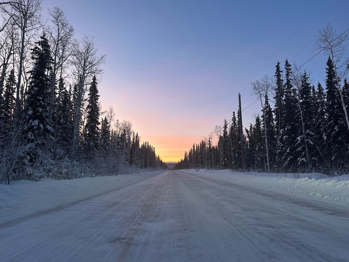 An icy road is seen here leading to the First Nation of Na-Cho Nyäk Dun, near the village of Mayo, on Jan. 11, 2023.  (Virginie Ann / CBC News - image credit)