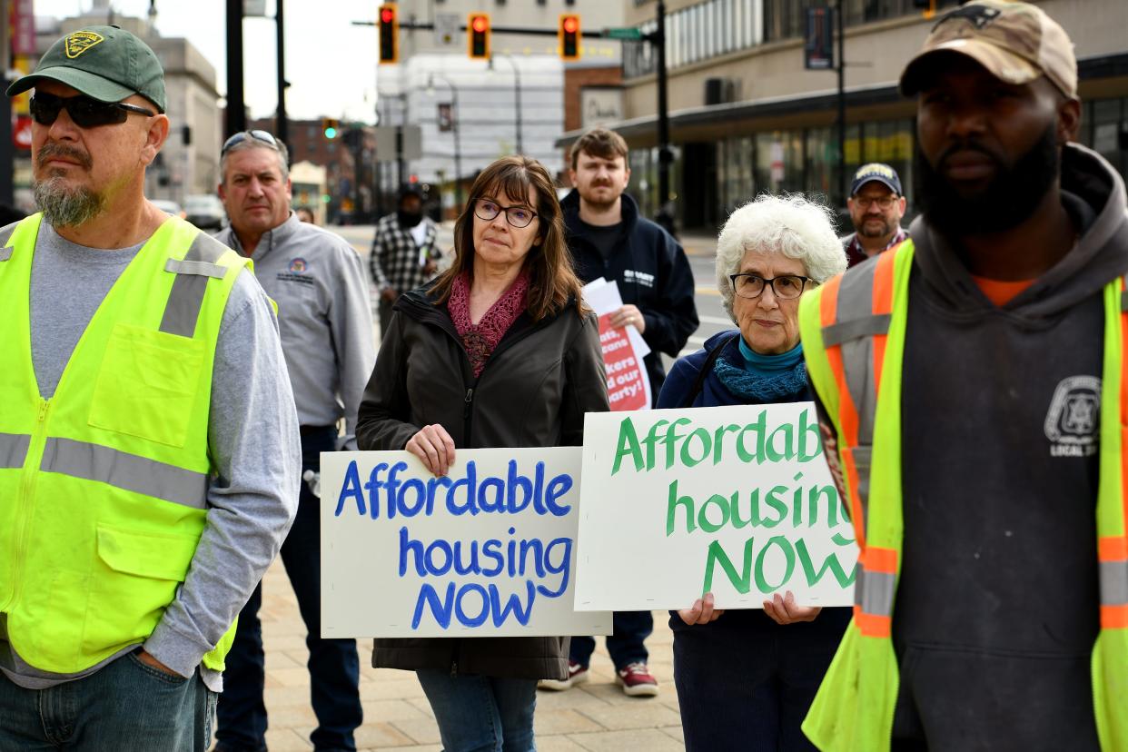 Margot Barnet, right, and Janet Davis, both of Worcester, participate in the May Day Rally for International Workers Day at Worcester City Hall.