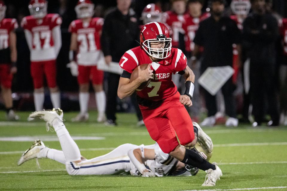 St. John's quarterback Dylan DiPietro rushes versus Shrewsbury High on Friday September 22, 2023 in Shrewsbury.