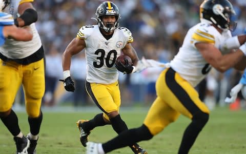 Pittsburgh Steelers running back James Conner (C) finds an open lane as he rushes for a touchdown in the first half during the NFL American Football game between the Pittsburg Steelers and the Los Angeles Chargers at the Dignity Health Sports Park in Carson, California, USA, 13 October 2019 - Credit: REX