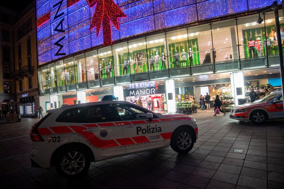 A police car in the area where a stabbing occurred in a department store, in Lugano, Switzerland (AP)