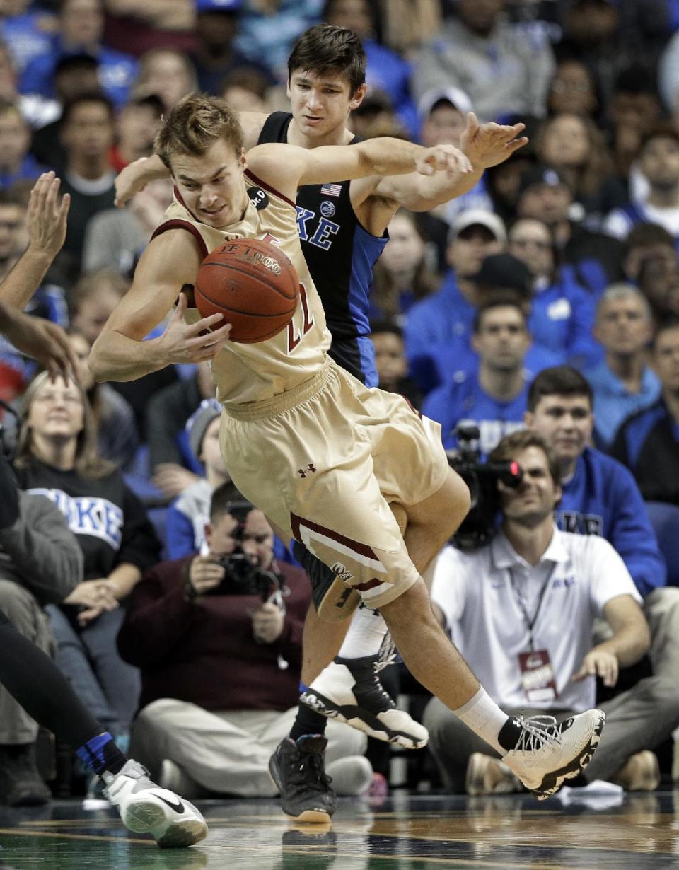 FILE - In this Dec. 21, 2016, file photo, Elon's Steven Santa Ana (22) is tripped by Duke's Grayson Allen, right, in the first half of an NCAA college basketball game in Greensboro, N.C. Allen has been indefinitely suspended for the incident, the third time he has been caught tripping an opponent in a year. (AP Photo/Chuck Burton, File)