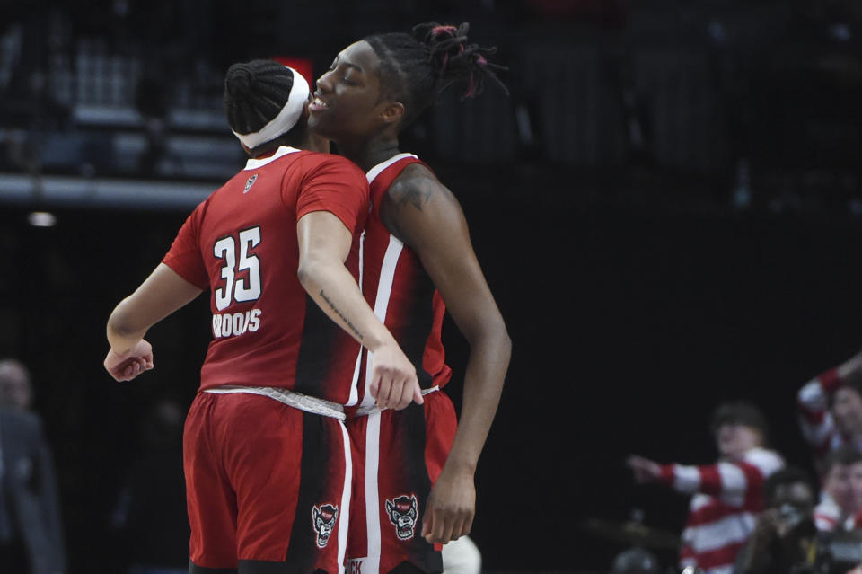 North Carolina State guard Zoe Brooks (35) and guard Saniya Rivers celebrate a shot against Texas during the first half of an Elite Eight college basketball game in the women's NCAA Tournament, Sunday, March 31, 2024, in Portland, Ore. (AP Photo/Steve Dykes)