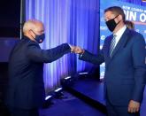 Erin O'Toole the new leader of Canada's main opposition Conservative Party fist bumps outgoing leader Andrew Scheer before giving his victory speech in Ottawa