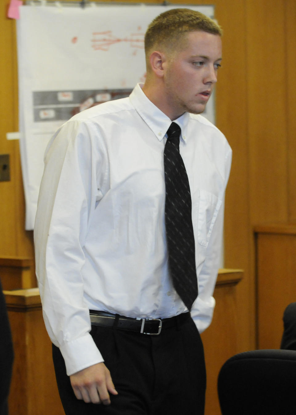 Defendant Aaron Deveau, 18, walks towards the stand at Haverhill District Court in Haverhill, Mass. Tuesday, June 5, 2012, where he is on trial on charges of motor vehicle homicide while texting. Authorities say the then-17-year-old Deveau was texting when he crossed the center line of a Haverhill street on Feb. 20, 2011 and crashed into a vehicle driven by 55-year-old Donald Bowley of Danville, N.H., who died 18 days later in the hospital. (AP Photo/Eagle Tribune, Paul Bilodeau, Pool)