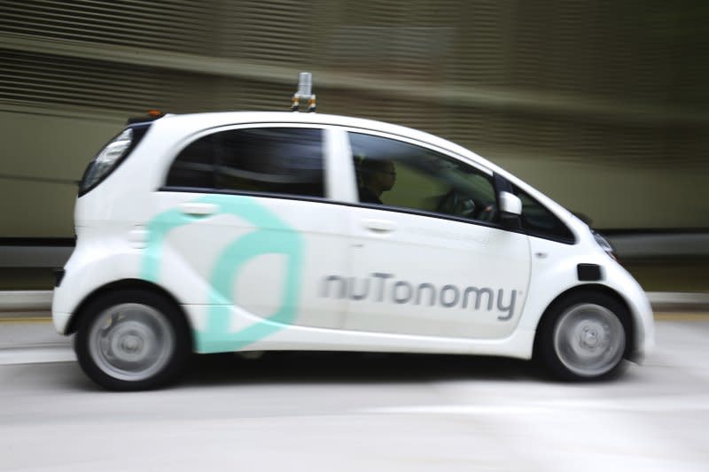 <cite>新加坡無人駕駛計程車「nuTonomy」（AP）</cite>