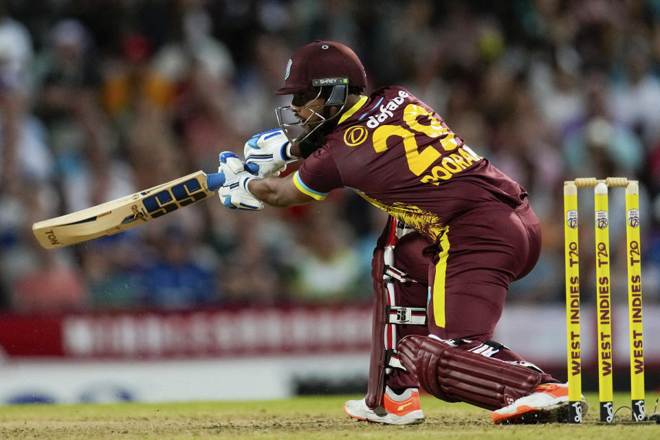 West Indies' Nicholas Pooran plays a shot against England during the first T20 cricket match at Kensington Oval in Bridgetown, Barbados, Tuesday, Dec. 12, 2023. (AP Photo/Ricardo Mazalan)