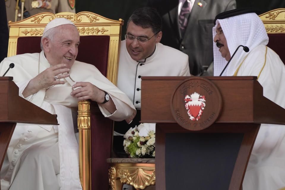 Pope Francis talks with Bahrain's King Hamad bin Isa Al Khalifa as they attend the closing session of the "Bahrain Forum for Dialogue: East and west for Human Coexistence", at the Al-Fida square at the Sakhir Royal palace, Bahrain, Friday, Nov. 4, 2022. Pope Francis is making the November 3-6 visit to participate in a government-sponsored conference on East-West dialogue and to minister to Bahrain's tiny Catholic community, part of his effort to pursue dialogue with the Muslim world. (AP Photo/Alessandra Tarantino)