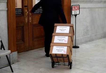 Boxes of evidence are brought to the court room for actor and comedian Bill Cosby's sexual assault retrial at the Montgomery County Courthouse in Norristown, Pennsylvania, U.S. April 23, 2018. REUTERS/Jessica Kourkounis