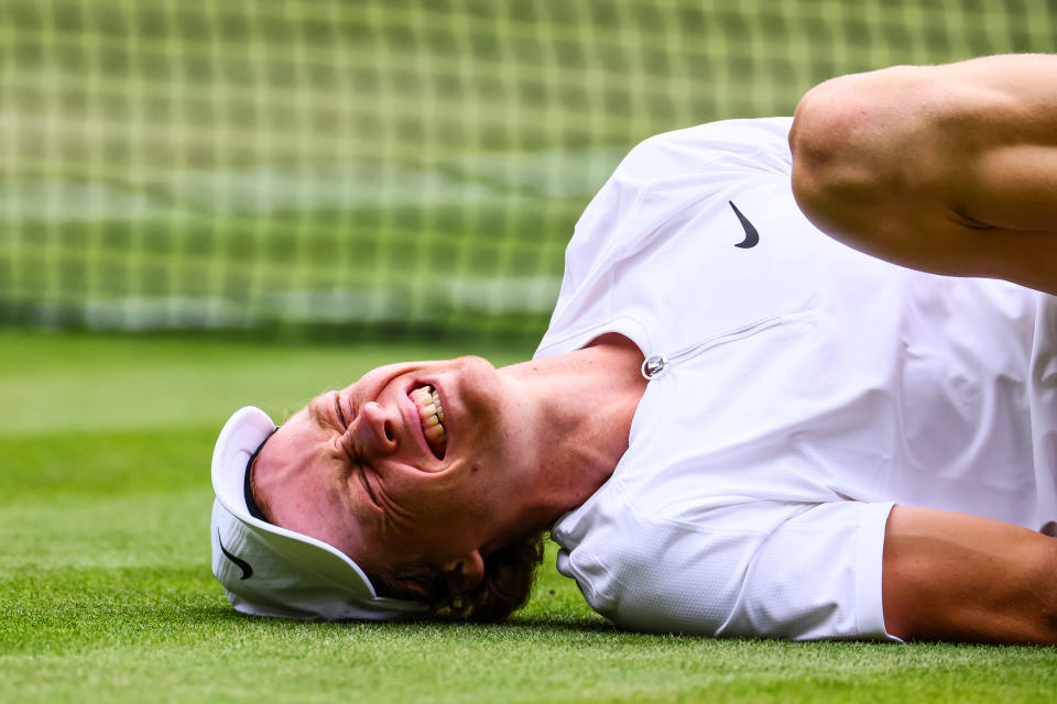 Jannik Sinner, pictured here after injuring his ankle against Novak Djokovic at Wimbledon.