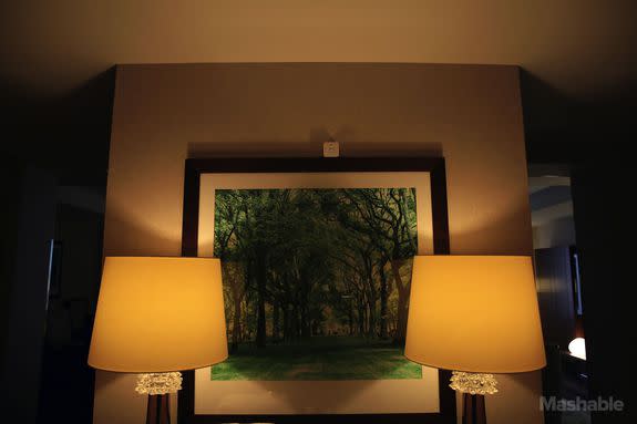 The Philips motion sensor is sitting on the top of this painting, no screws required.