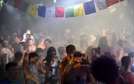 Club-goers dance at 'Morning Gloryville' at the Ministry of Sound in south London August 11, 2015. REUTERS/Toby Melville