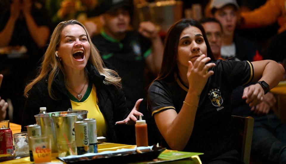 Monica Neiva, left, of Framingham, reacts to a missed scoring opportunity by Brazil during its World Cup soccer match Friday against Cameroon while watching at the Tropical Cafe in downtown Framingham, Dec. 2, 2022.