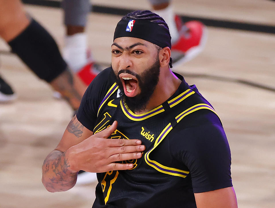 Lakers star Anthony Davis celebrates his buzzer-beating game-winner on Sunday. (Kevin C. Cox/Getty Images)